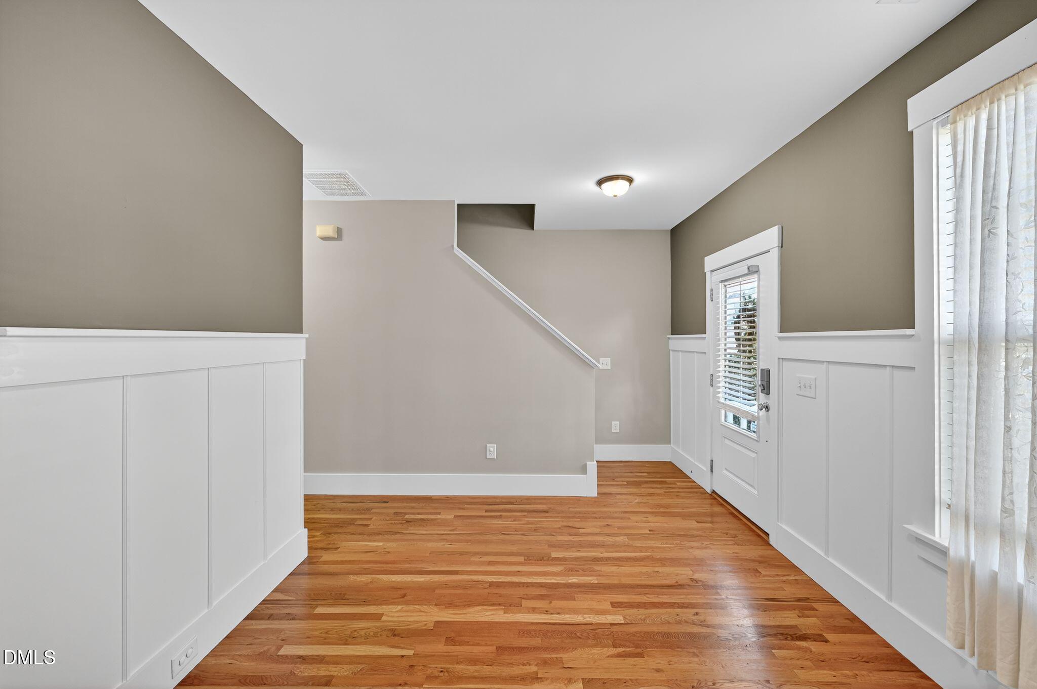 44 Owen Towne Road Chapel Hill, NC 27516 - Photo 16 of 64 a view of an empty room with wooden floor and stairs