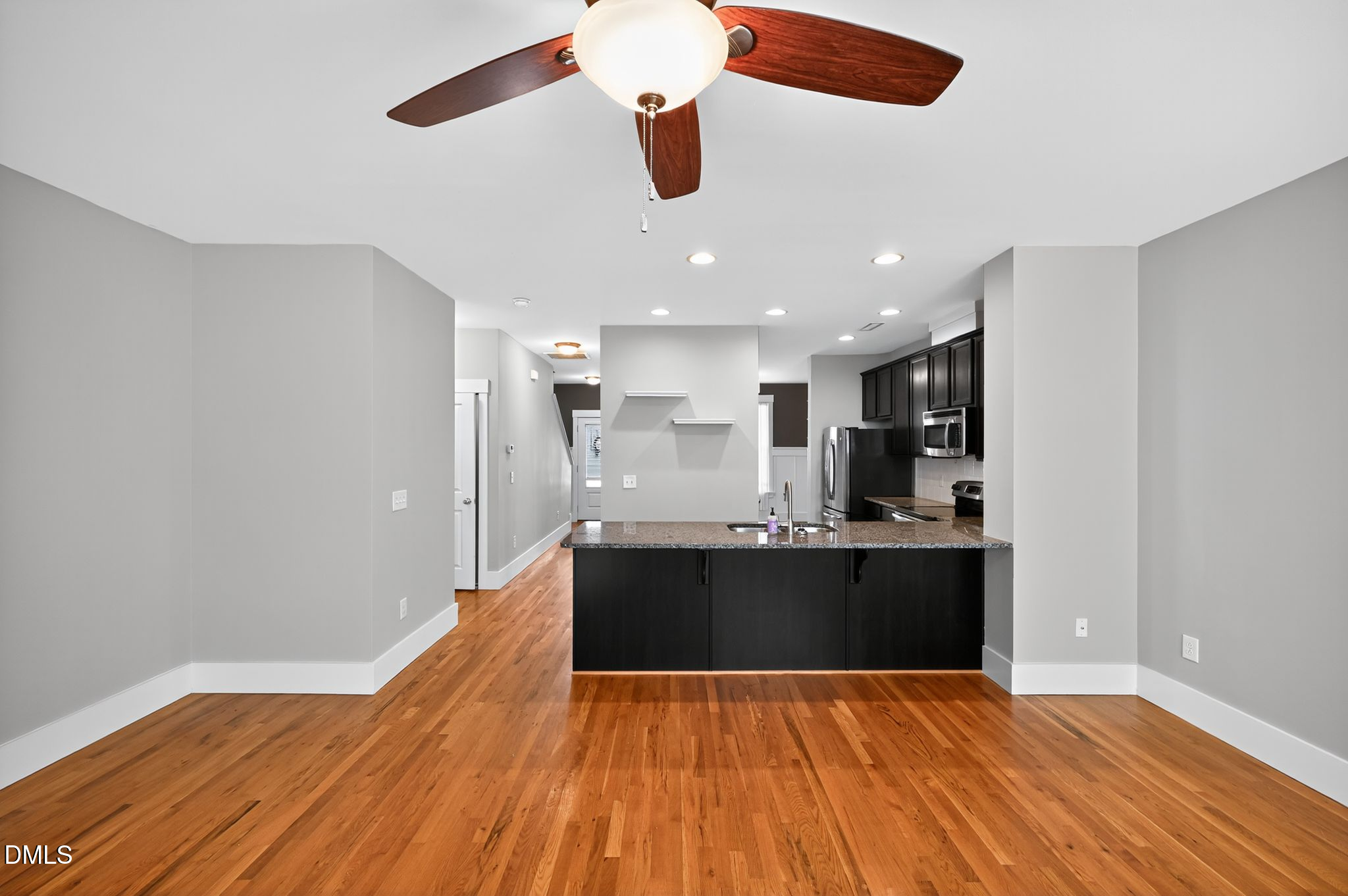 44 Owen Towne Road Chapel Hill, NC 27516 - Photo 54 of 64 a view of kitchen and empty room with wooden floor