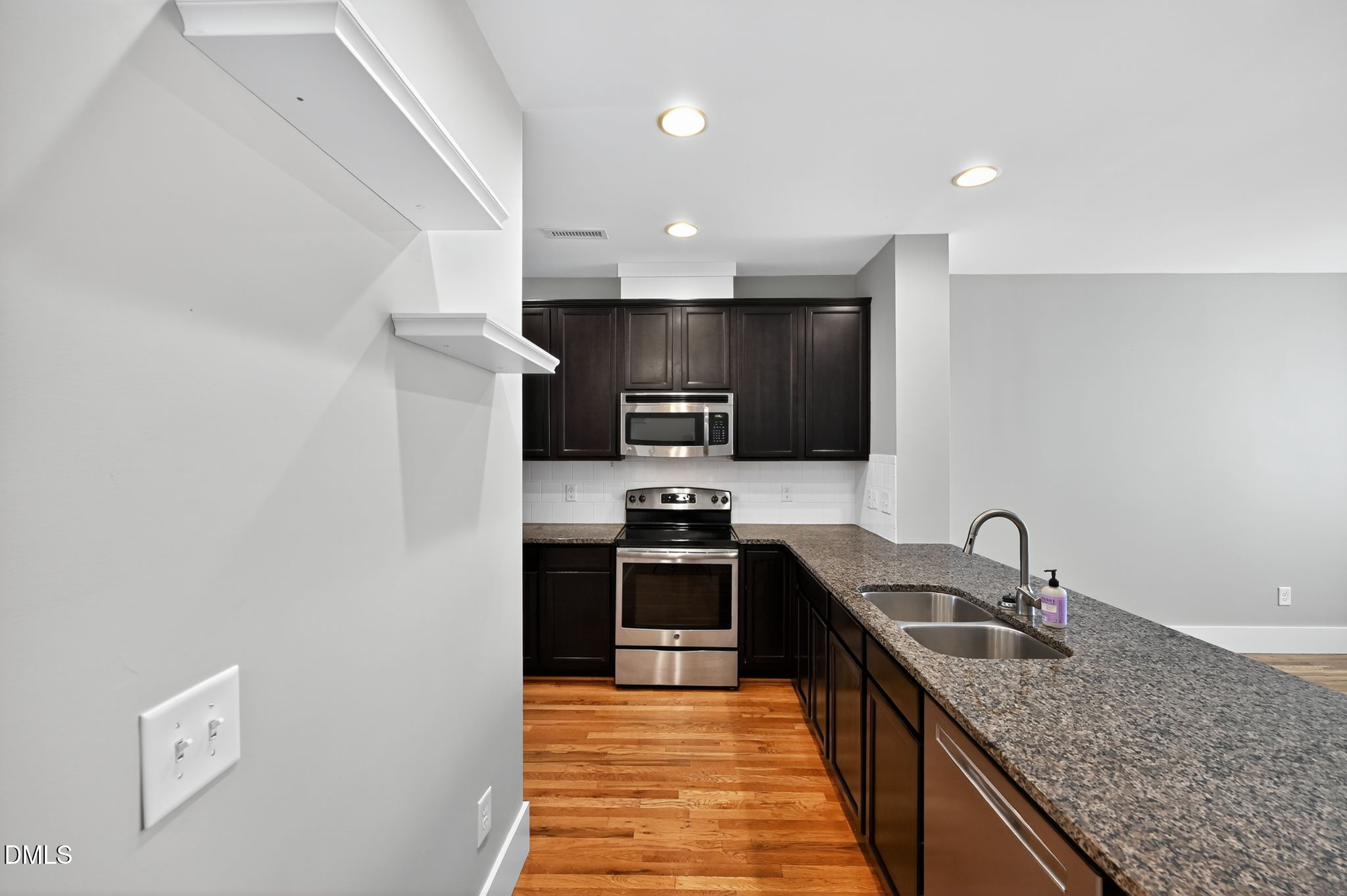 44 Owen Towne Road Chapel Hill, NC 27516 - Photo 61 of 64 a kitchen with granite countertop a sink and stainless steel appliances