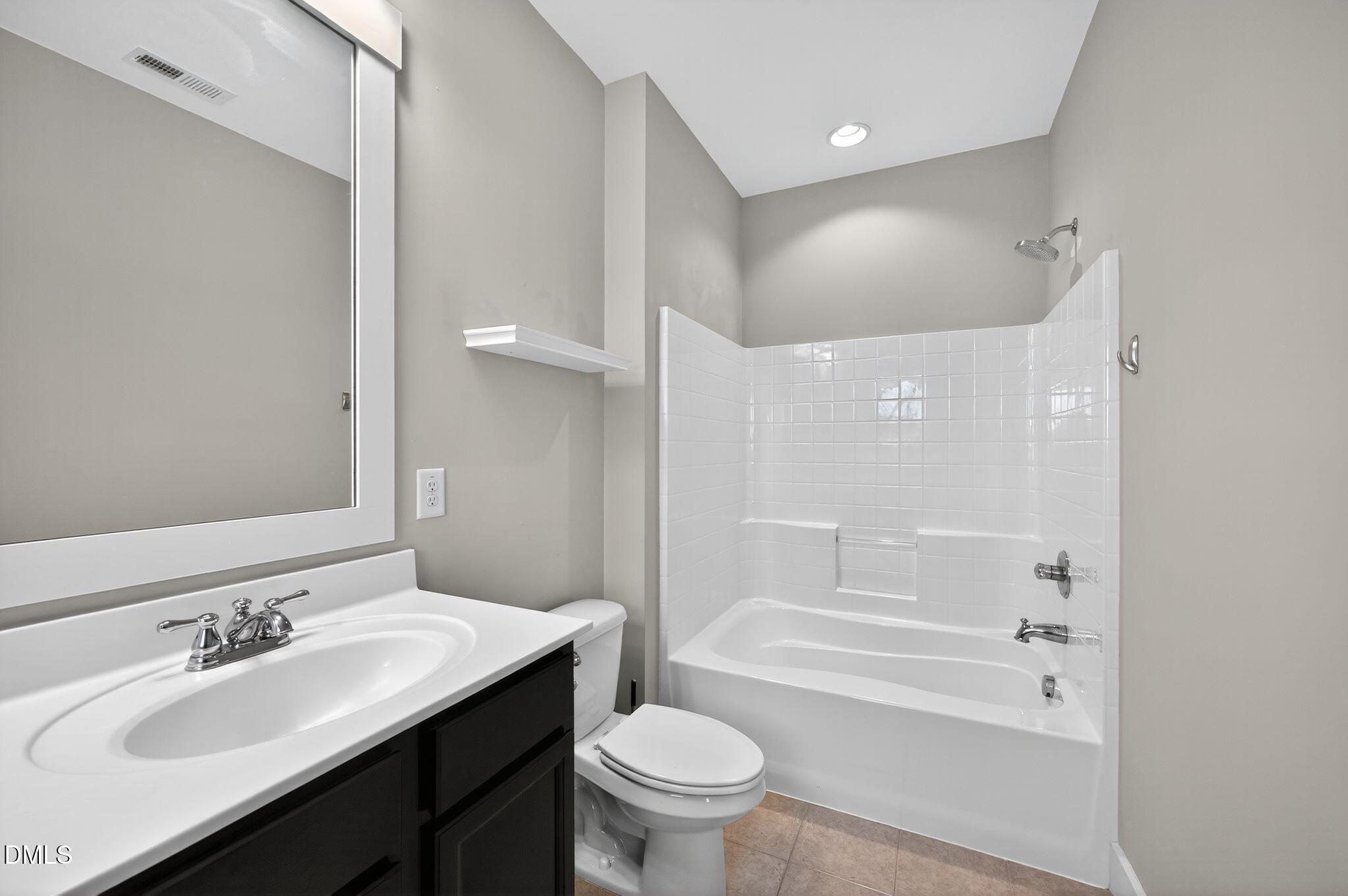 44 Owen Towne Road Chapel Hill, NC 27516 - Photo 27 of 64 a bathroom with a sink a toilet and shower