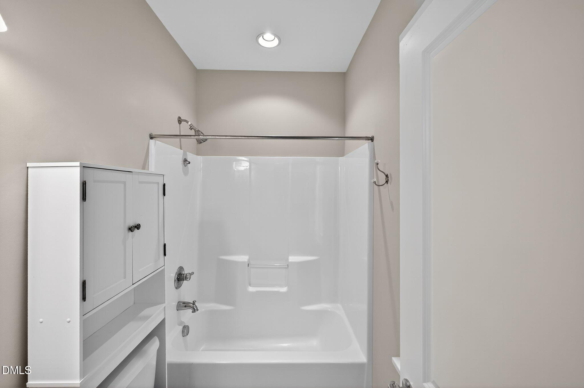 44 Owen Towne Road Chapel Hill, NC 27516 - Photo 29 of 64 a bathroom with a bathtub and a shower