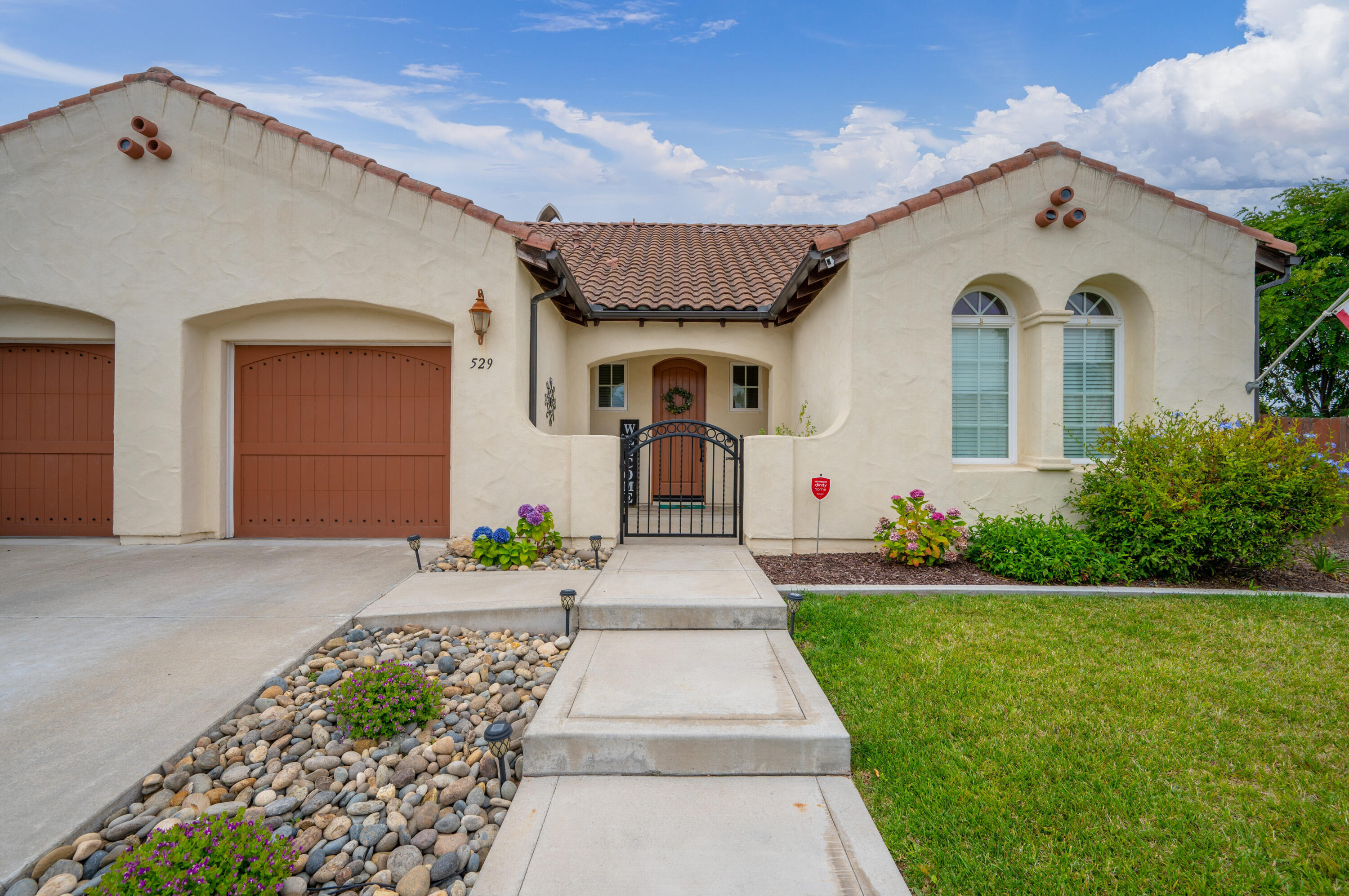 529 Palomar Circle Lompoc, CA 93436 - Photo 1 of 42 a front view of a house with garden