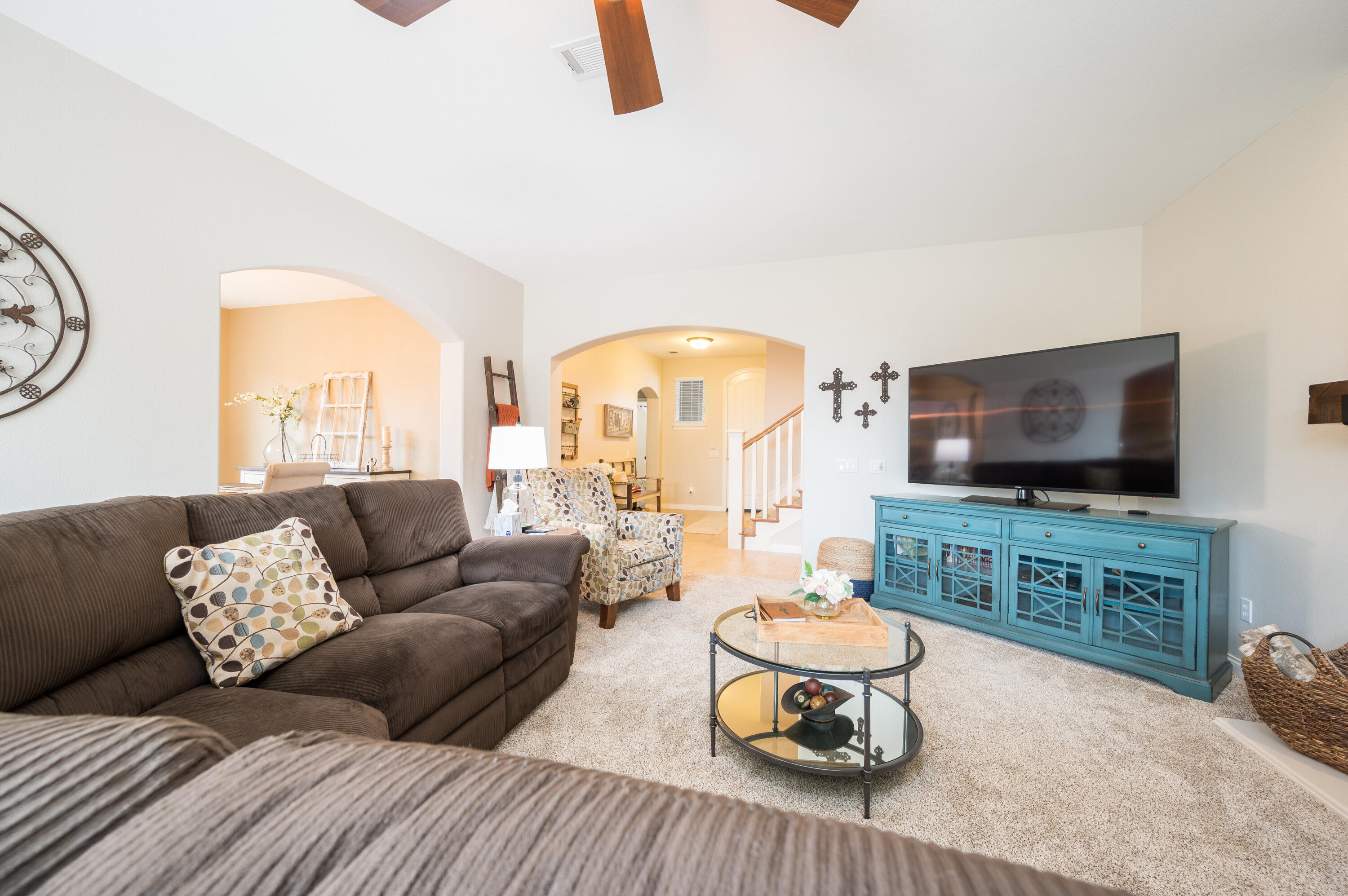 529 Palomar Circle Lompoc, CA 93436 - Photo 12 of 42 a living room with furniture a flat screen tv and a floor to ceiling window