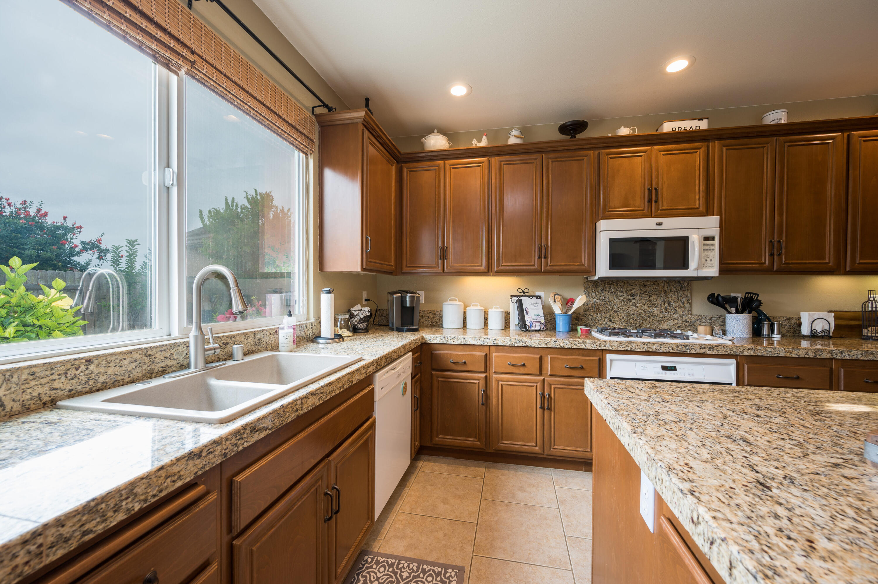 529 Palomar Circle Lompoc, CA 93436 - Photo 15 of 42 a kitchen with stainless steel appliances granite countertop a sink stove and cabinets