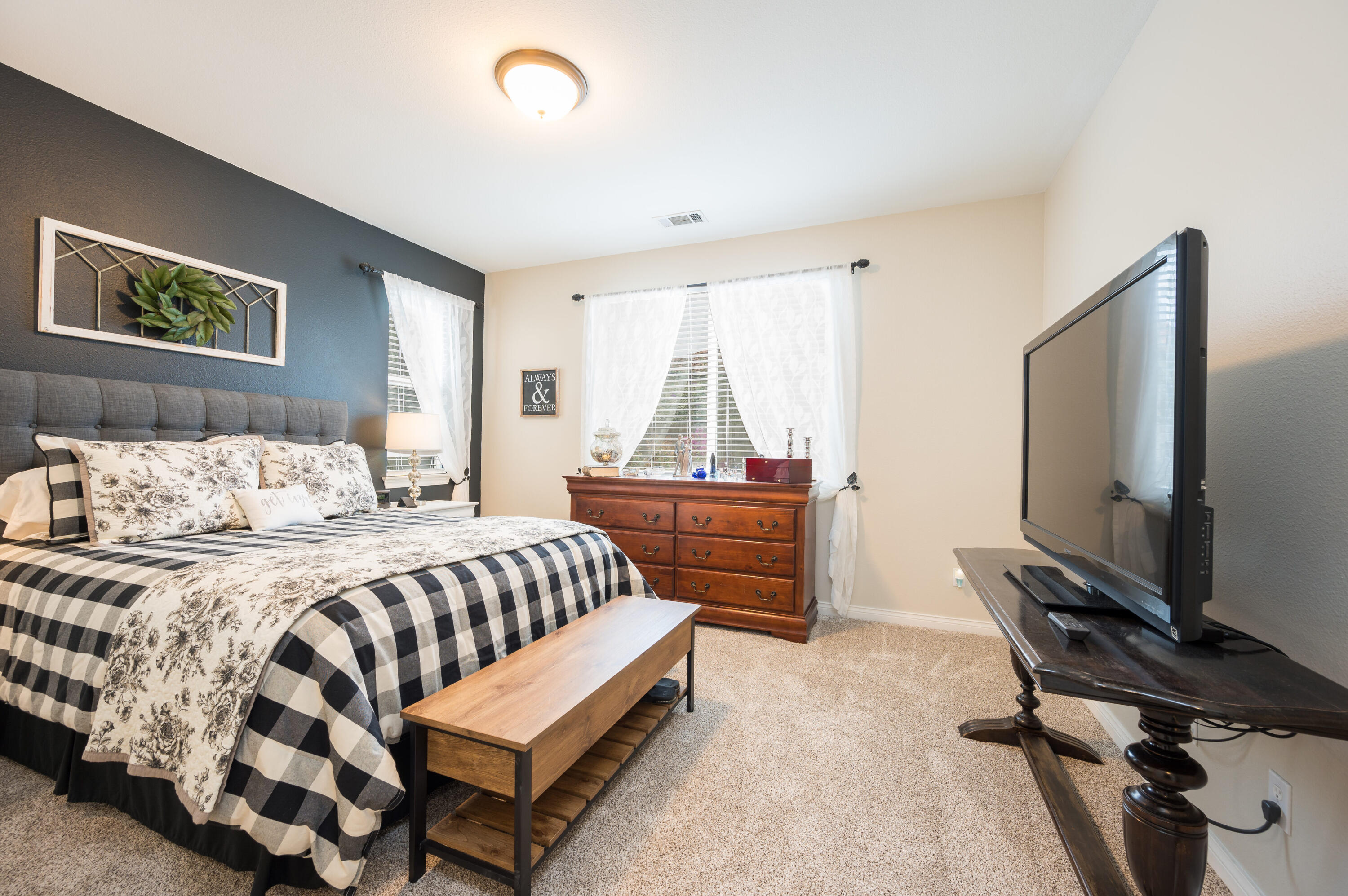 529 Palomar Circle Lompoc, CA 93436 - Photo 17 of 42 a bedroom with a bed and a flat tv screen on dresser