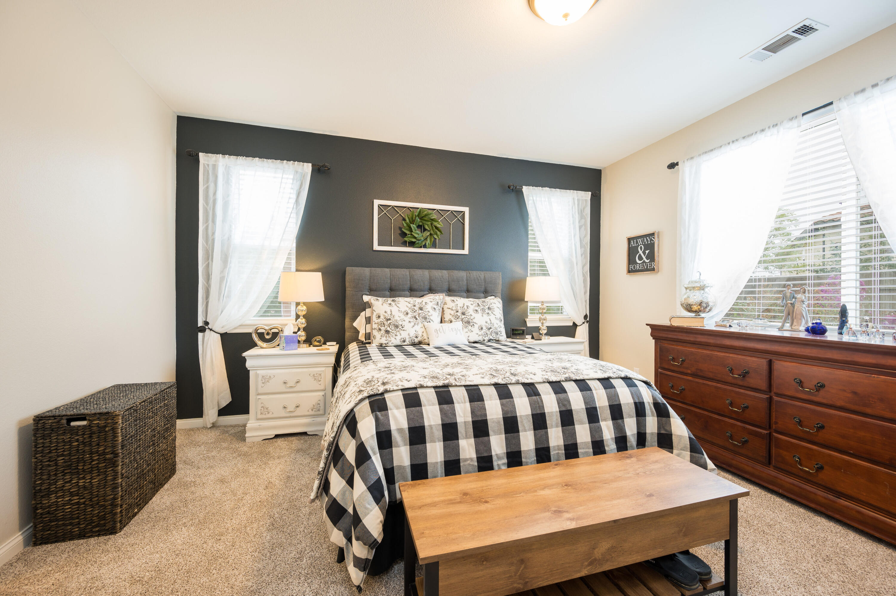 529 Palomar Circle Lompoc, CA 93436 - Photo 18 of 42 a bedroom with a bed and wooden floor