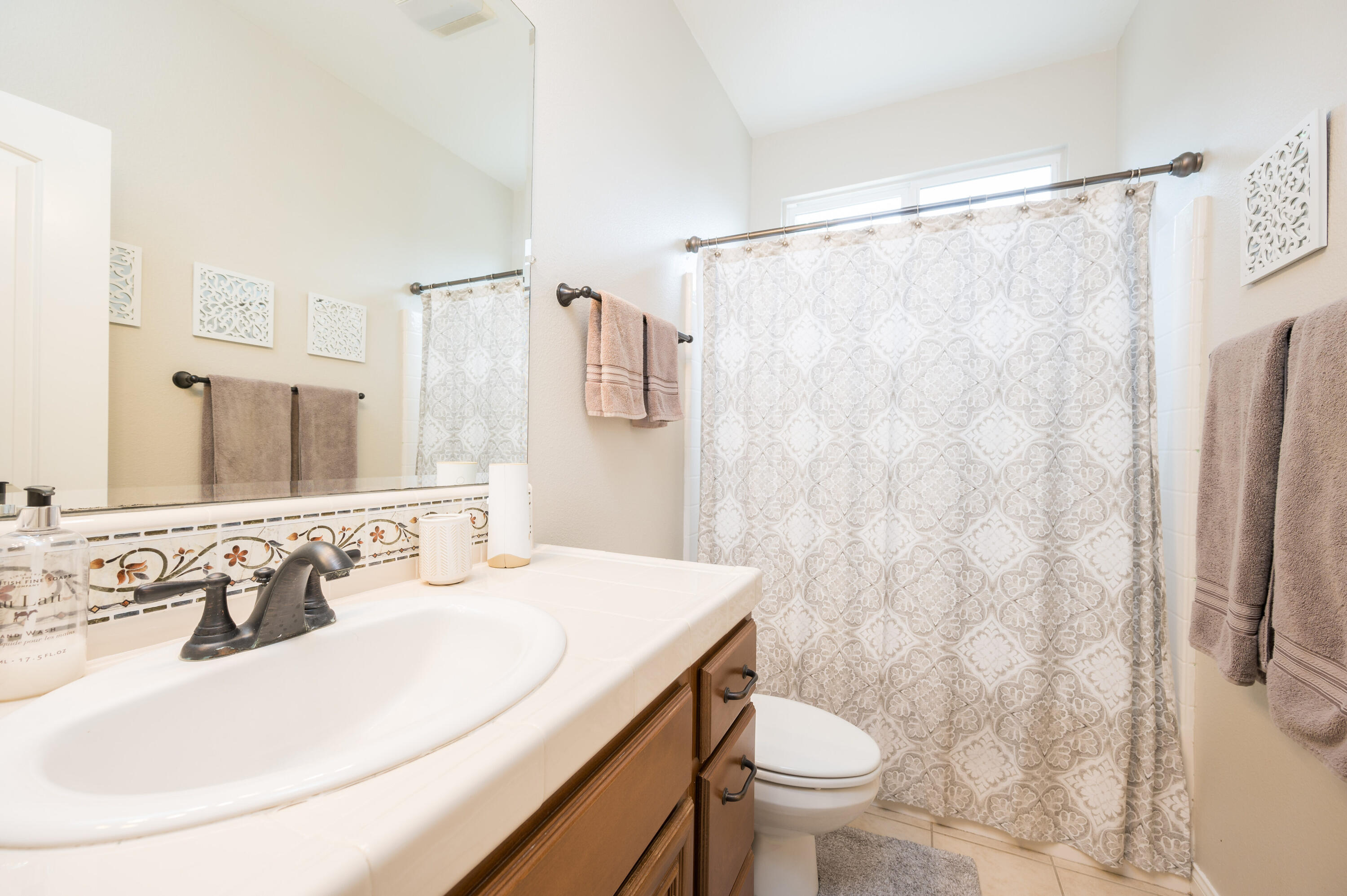 529 Palomar Circle Lompoc, CA 93436 - Photo 25 of 42 a bathroom with a sink toilet and shower