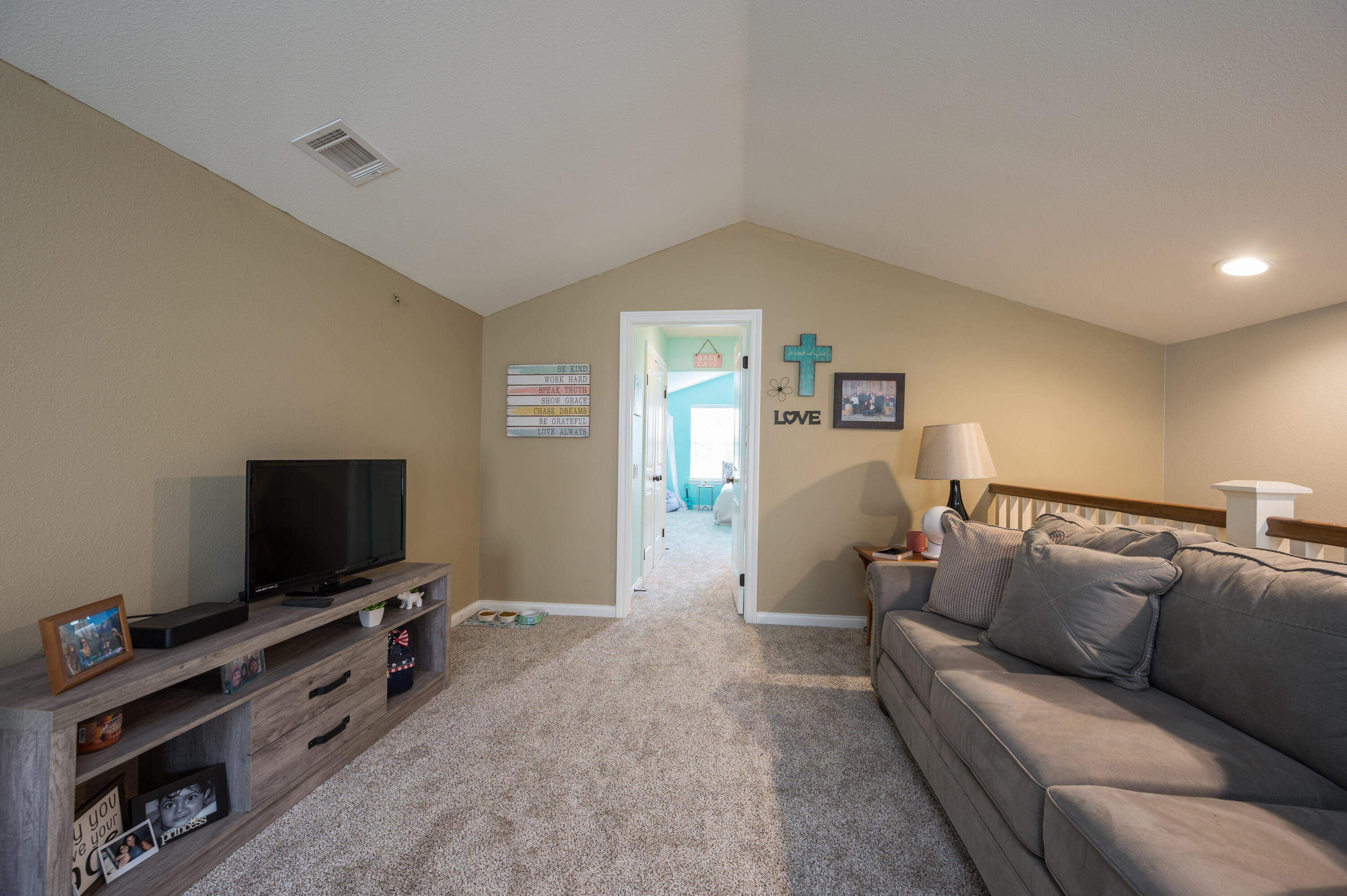 529 Palomar Circle Lompoc, CA 93436 - Photo 30 of 42 a living room with furniture and a flat screen tv