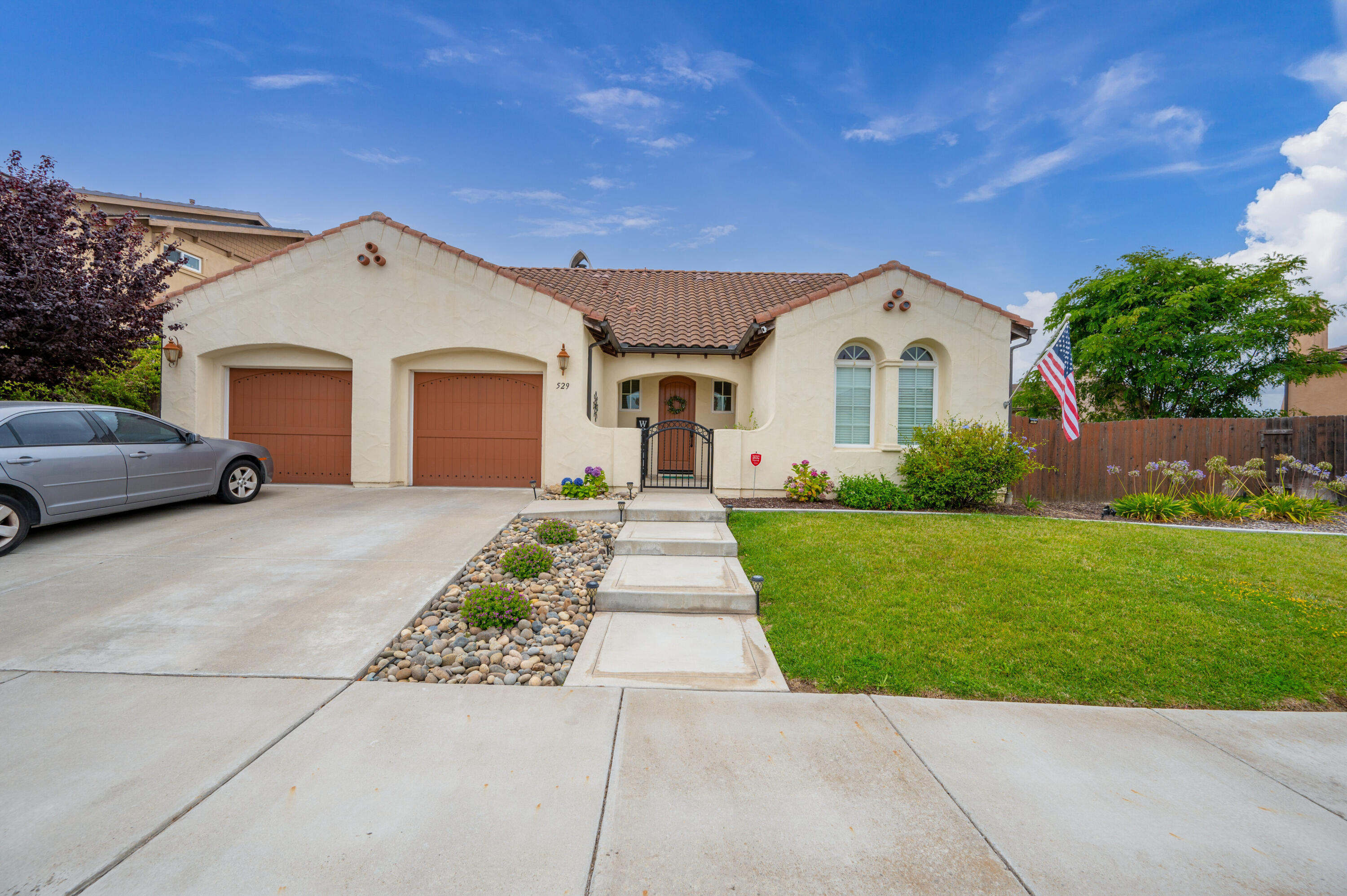 529 Palomar Circle Lompoc, CA 93436 - Photo 3 of 42 a front view of a house with a yard and garage