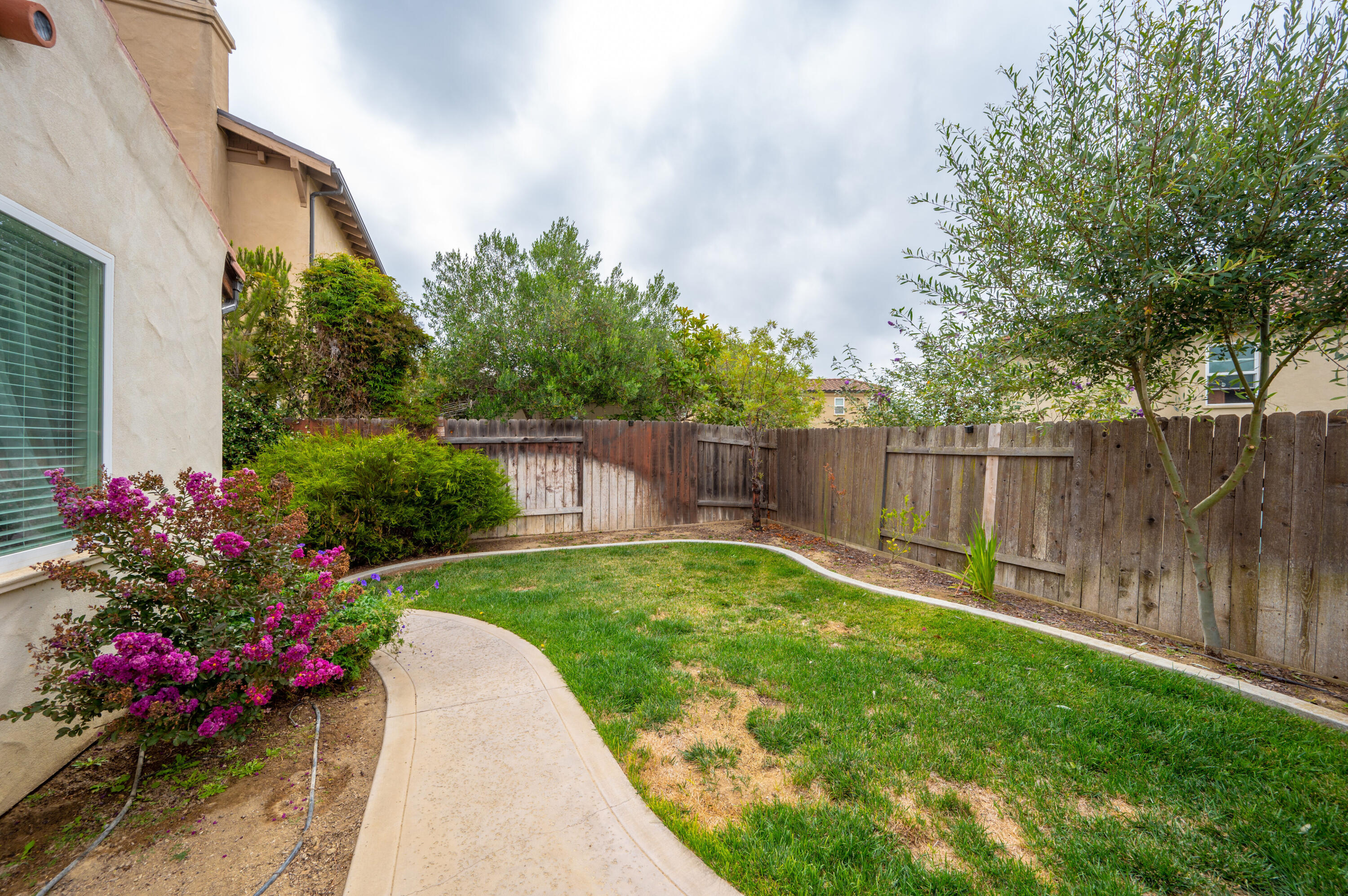 529 Palomar Circle Lompoc, CA 93436 - Photo 40 of 42 a view of a backyard with a garden