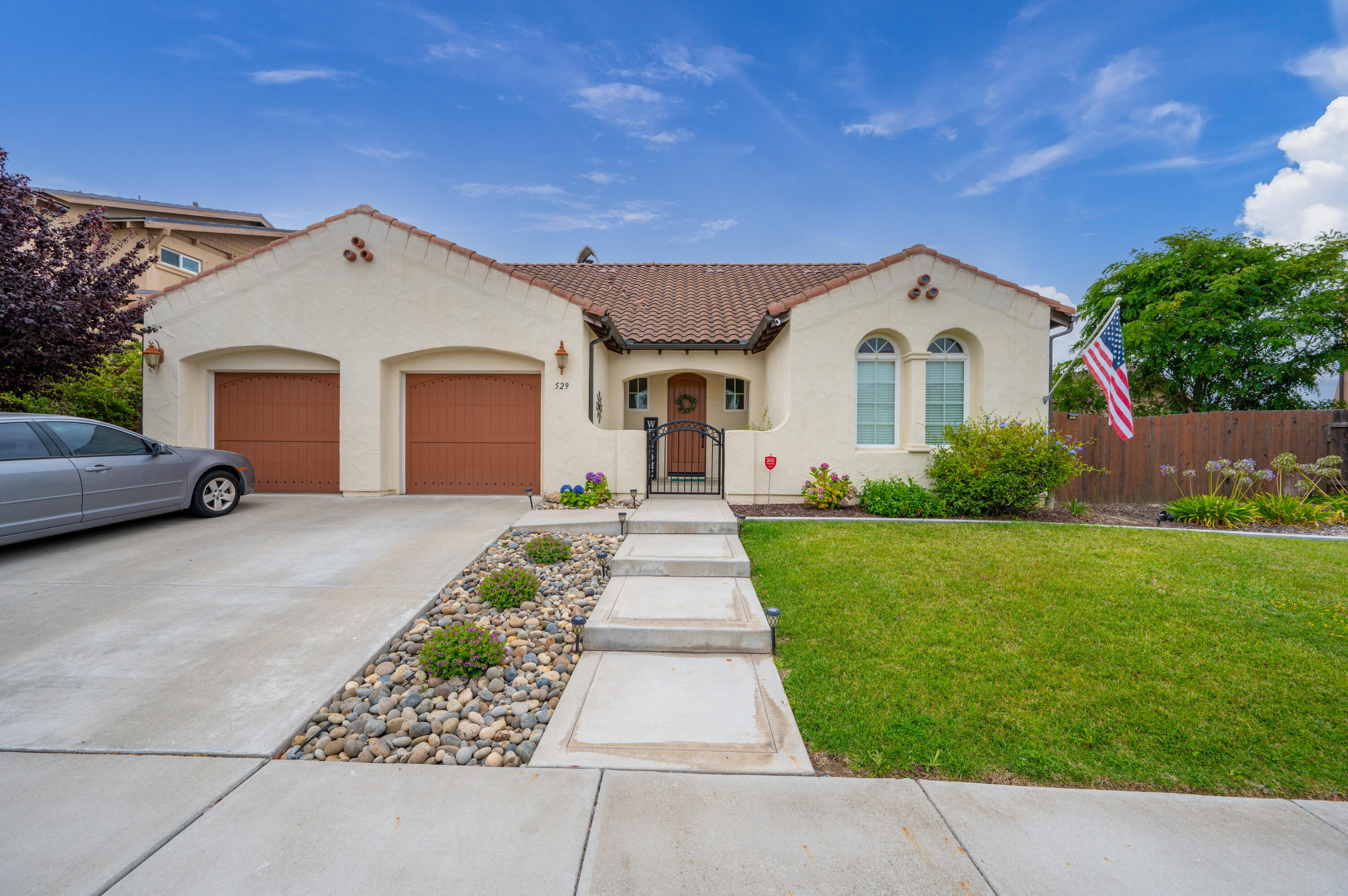 529 Palomar Circle Lompoc, CA 93436 - Photo 5 of 42 a front view of a house with a yard and garage
