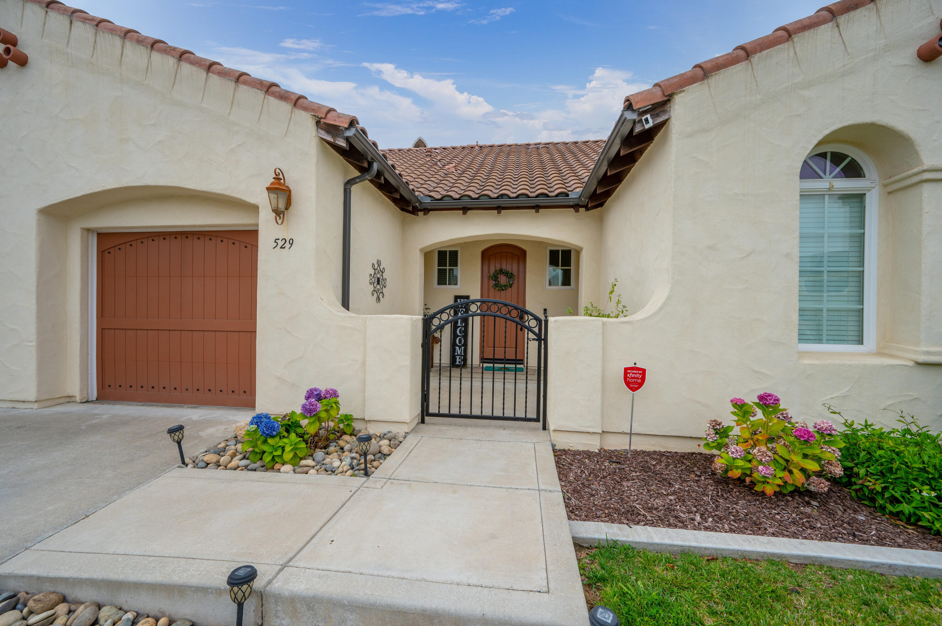 529 Palomar Circle Lompoc, CA 93436 - Photo 6 of 42 a front view of a house with a garden