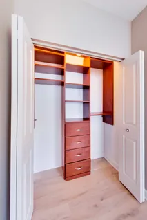 a view of walk in closet with empty racks