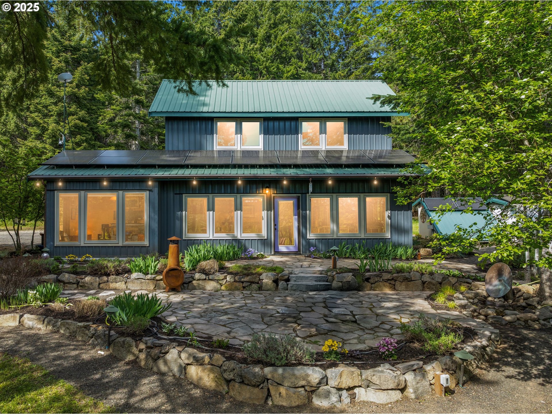961 Snowden Road White Salmon, WA 98672 - Photo 1 of 48 a front view of house with a garden