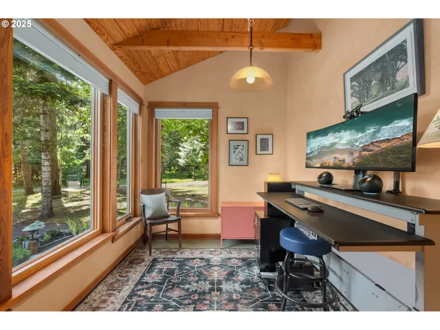 a room with furniture pool table and windows
