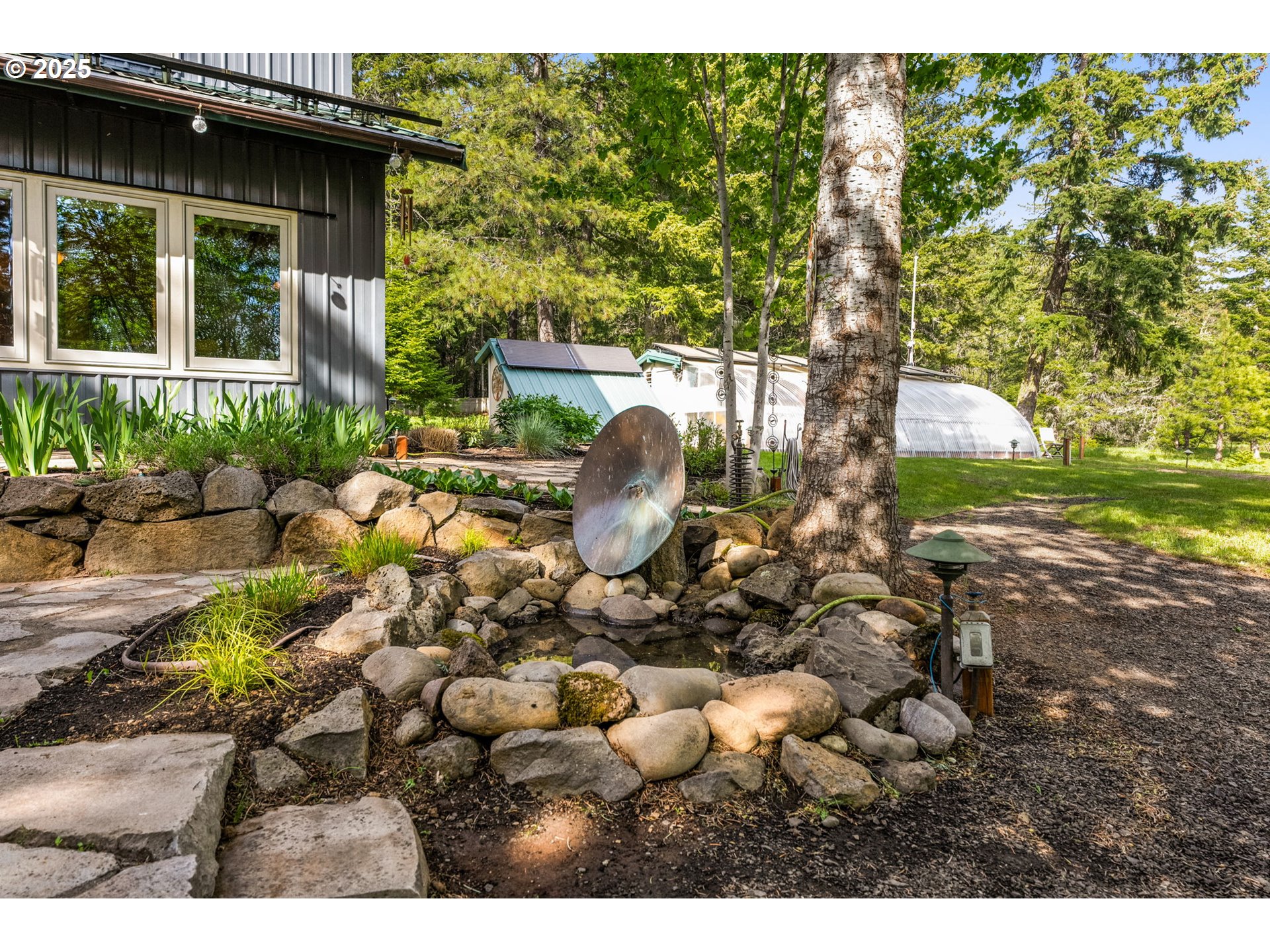 961 Snowden Road White Salmon, WA 98672 - Photo 24 of 48 a backyard of a house with table and chairs