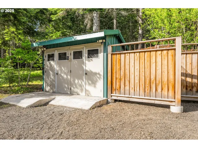 a view of a house with swimming pool and sitting area