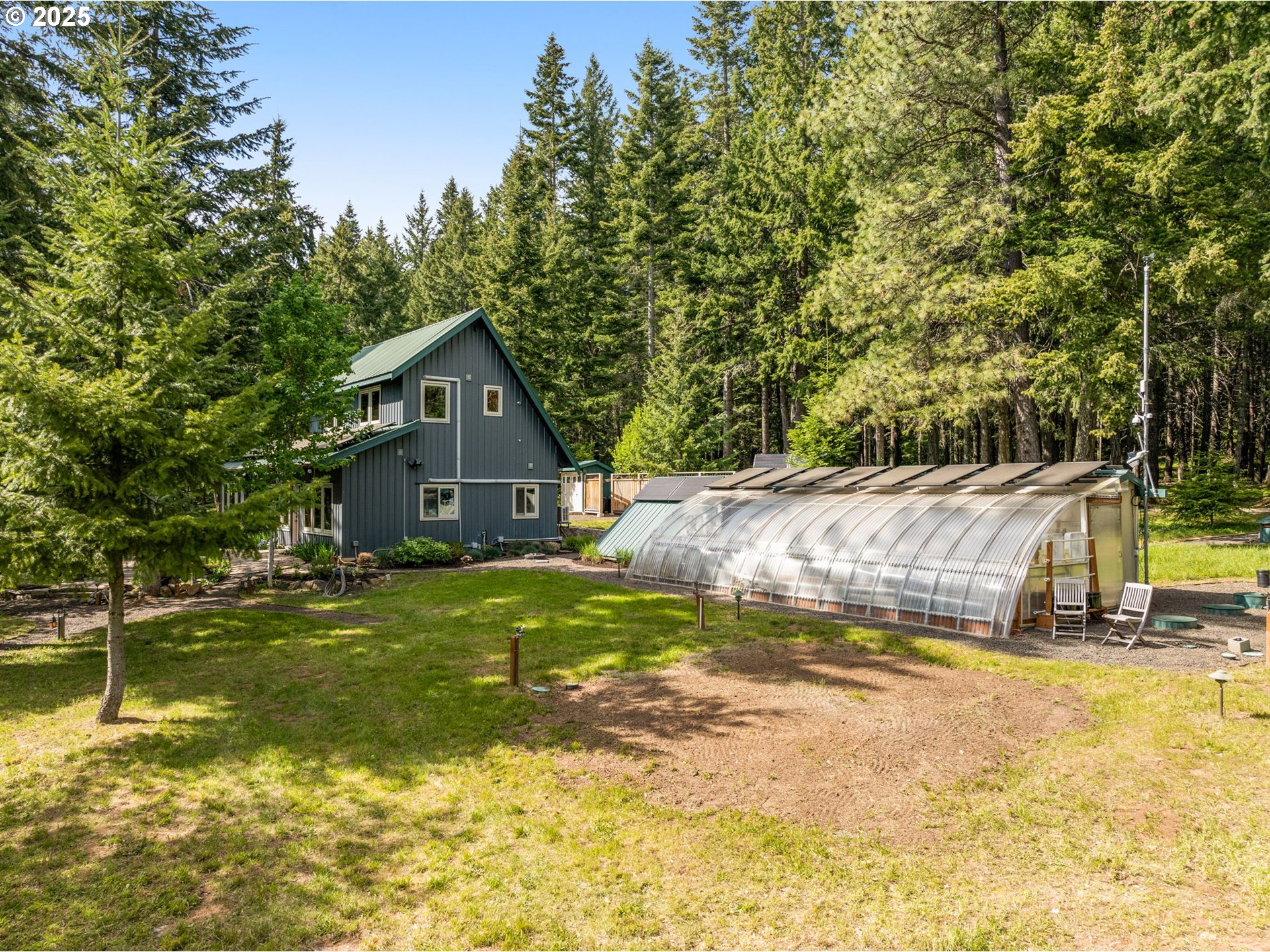 961 Snowden Road White Salmon, WA 98672 - Photo 26 of 48 a view of a house with swimming pool and sitting area