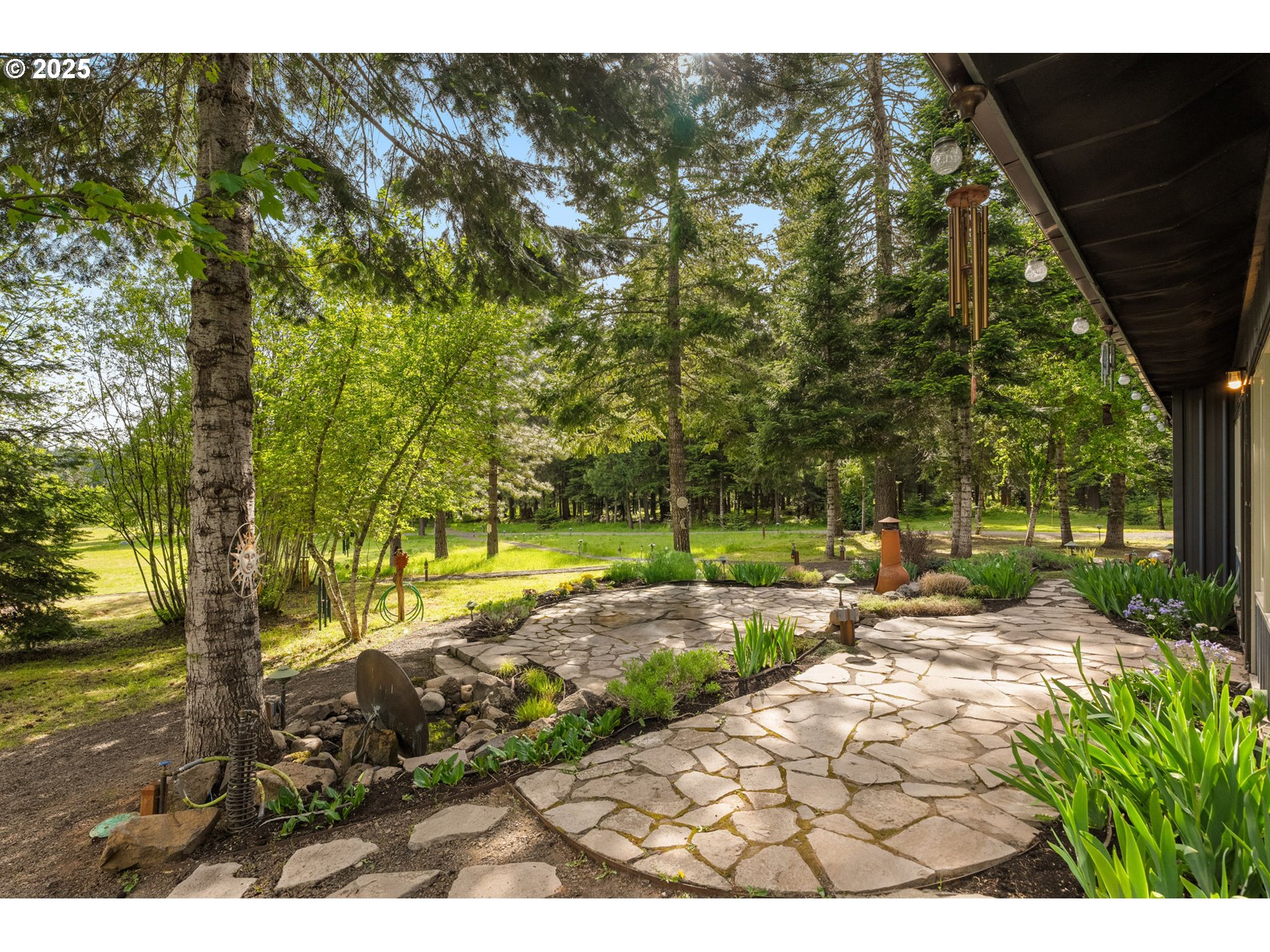 961 Snowden Road White Salmon, WA 98672 - Photo 3 of 48 a view of a yard with plants and trees