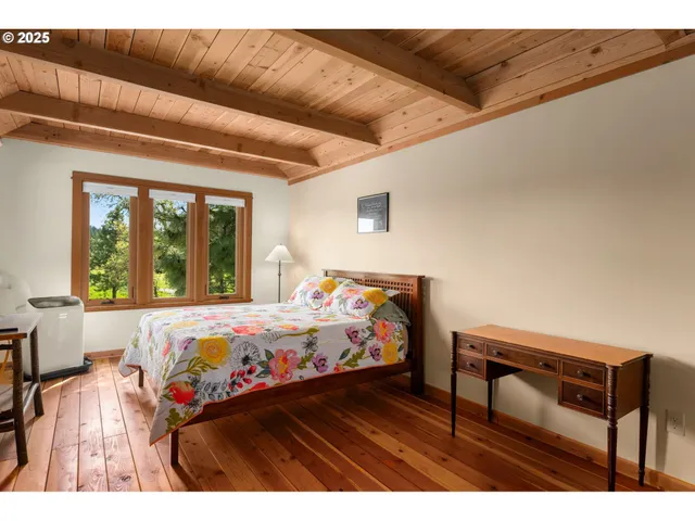 a view of a living room with furniture and a kitchen