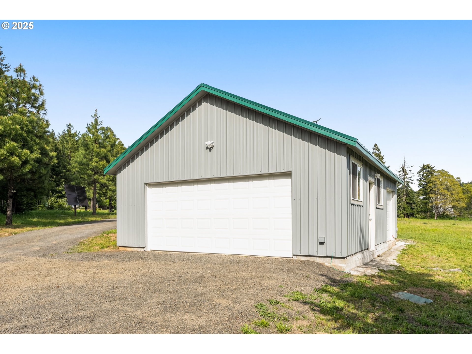 961 Snowden Road White Salmon, WA 98672 - Photo 38 of 48 a backyard of a house with wooden fence