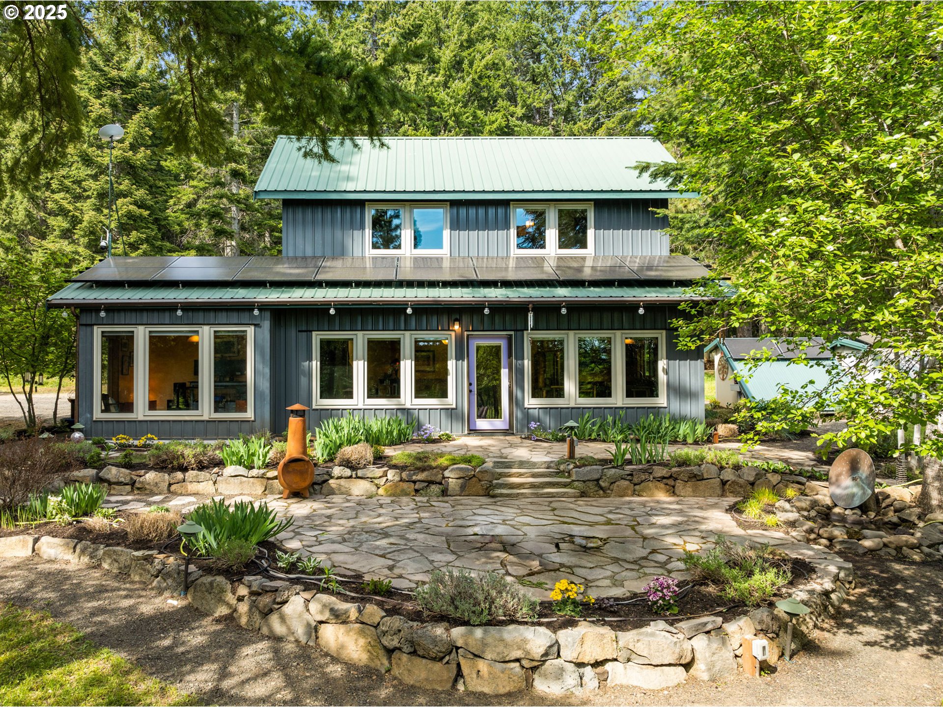 961 Snowden Road White Salmon, WA 98672 - Photo 41 of 48 a front view of a house with garden and porch
