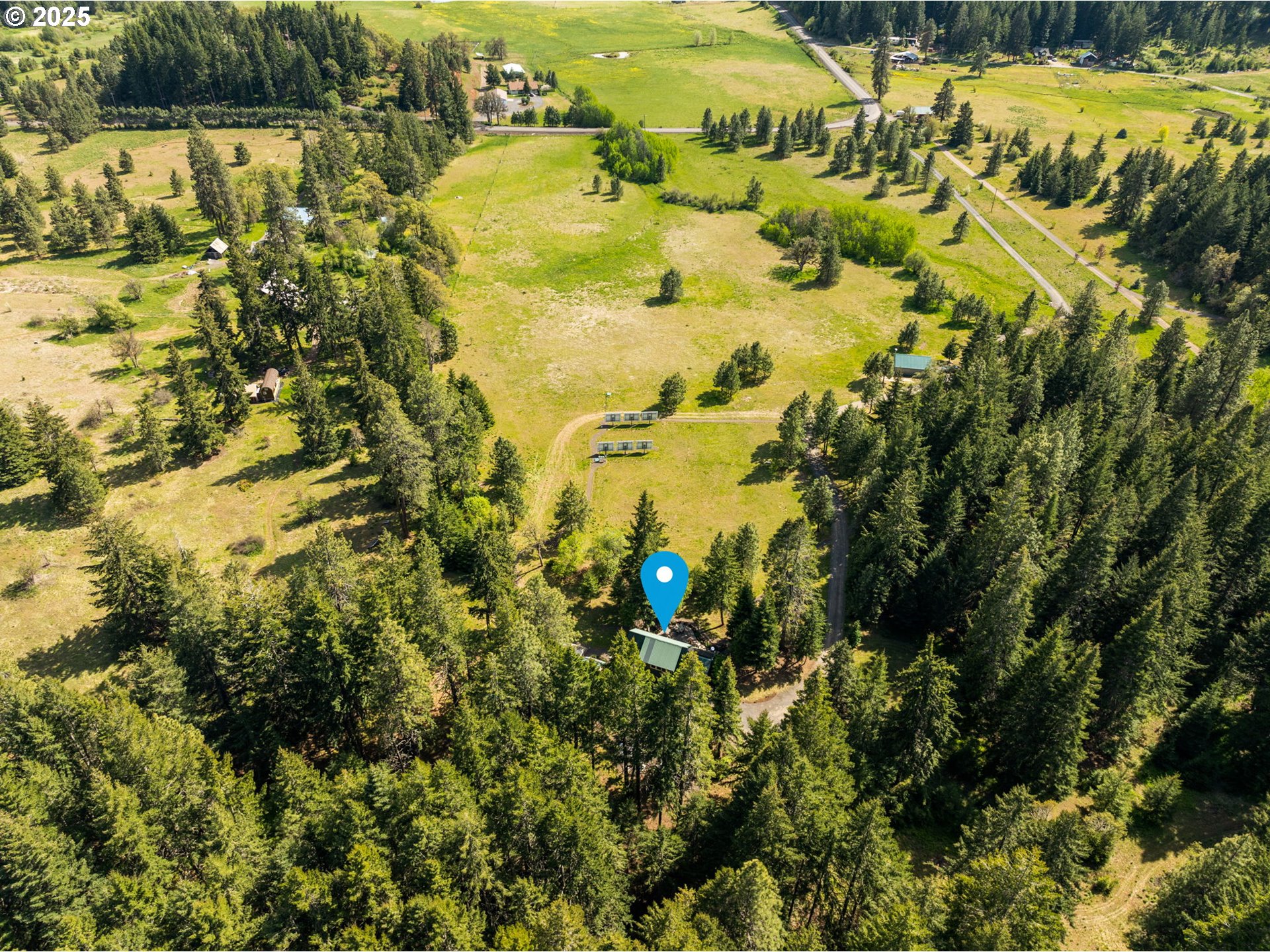 961 Snowden Road White Salmon, WA 98672 - Photo 44 of 48 a view of a lake with a building