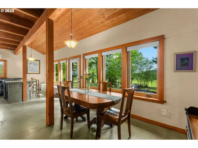 a dining room with furniture and window