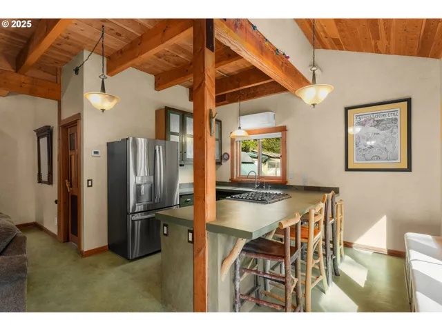 a view of kitchen and dining area with wooden floor