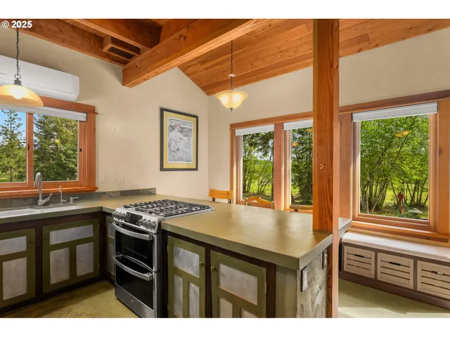 a kitchen with a stove a sink and a refrigerator