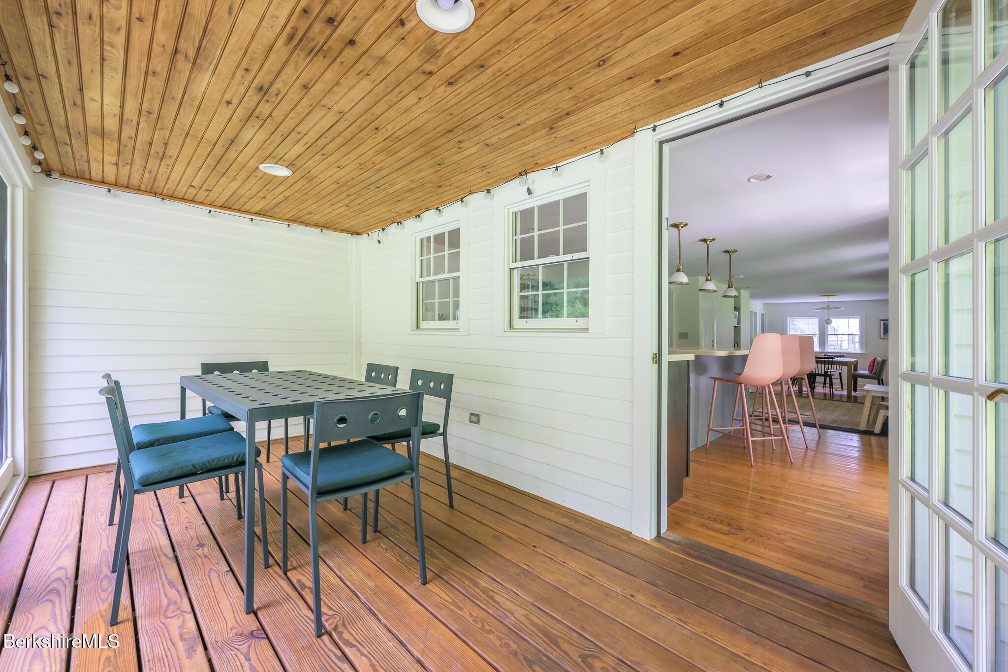 270 Hillsdale Road Egremont, MA 01230 - Photo 13 of 39 a view of a patio with table and chairs with wooden floor and fence