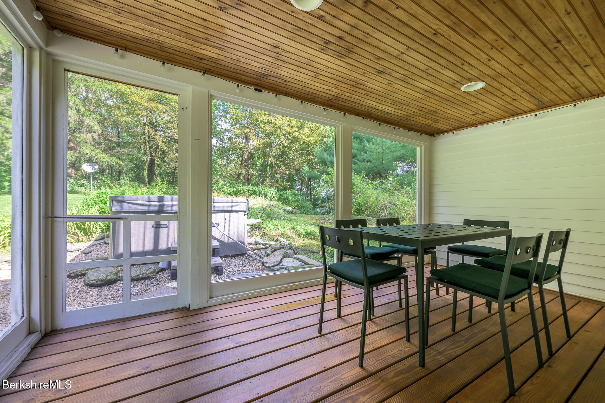 270 Hillsdale Road Egremont, MA 01230 - Photo 14 of 39 a view of a patio with table and chairs and wooden floor