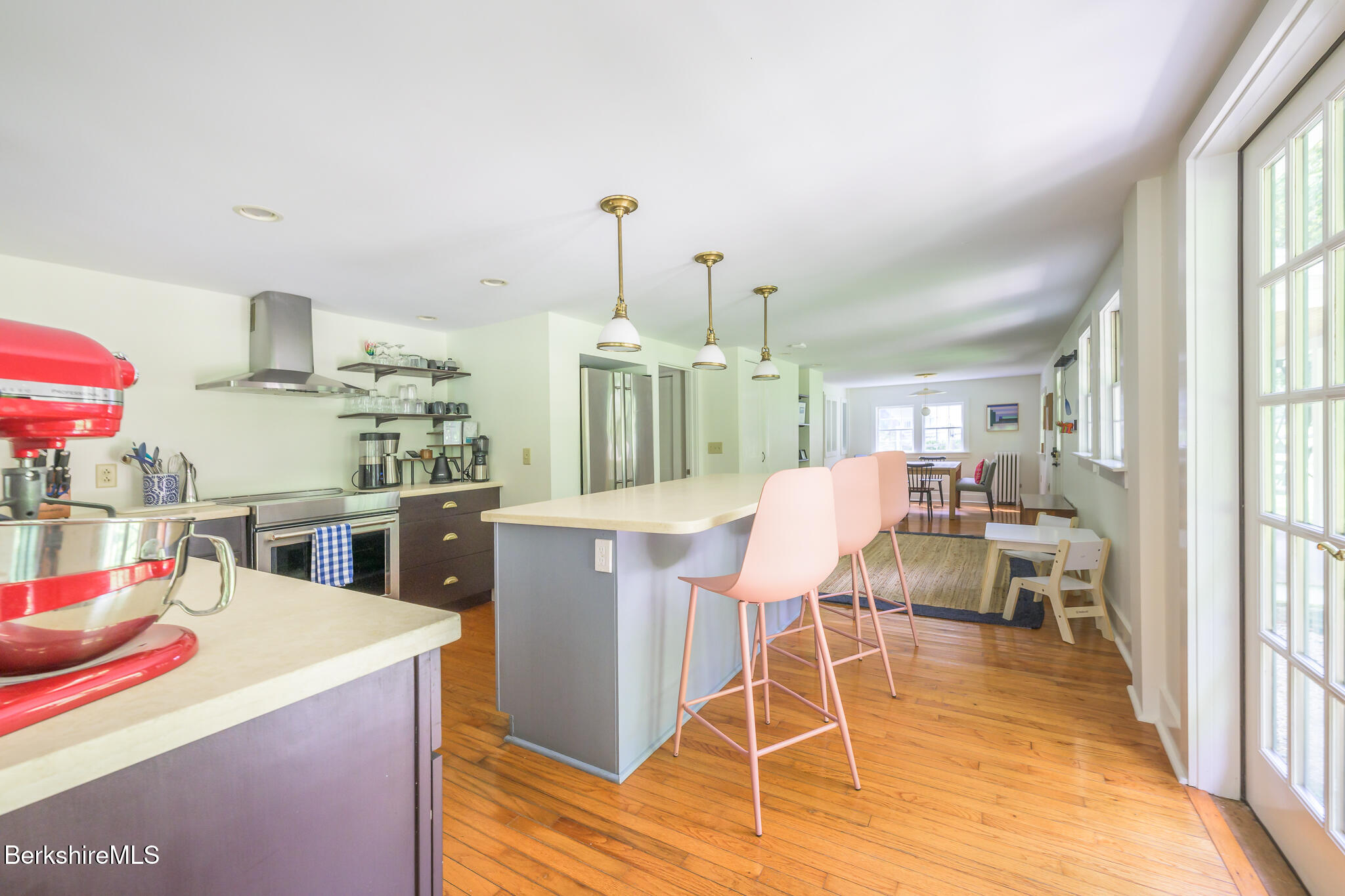 270 Hillsdale Road Egremont, MA 01230 - Photo 15 of 39 a kitchen with stainless steel appliances kitchen island granite countertop a table chairs and a view of living room