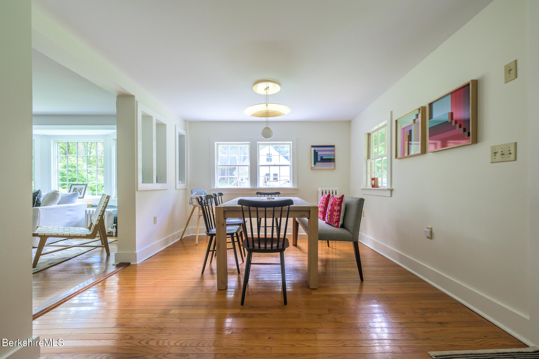 270 Hillsdale Road Egremont, MA 01230 - Photo 16 of 39 a dining room with wooden floor a potted plant and windows