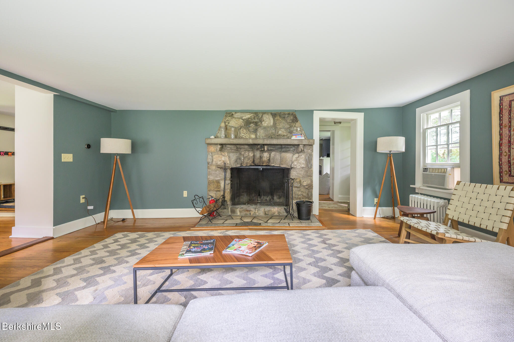 270 Hillsdale Road Egremont, MA 01230 - Photo 19 of 39 a living room with patio furniture and a fireplace