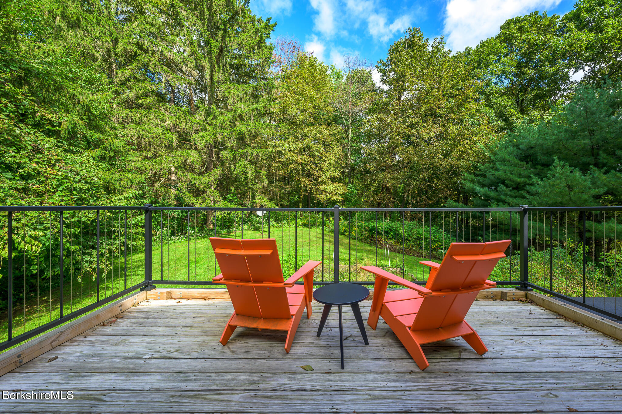 270 Hillsdale Road Egremont, MA 01230 - Photo 25 of 39 a chairs sitting on a deck with a lake view