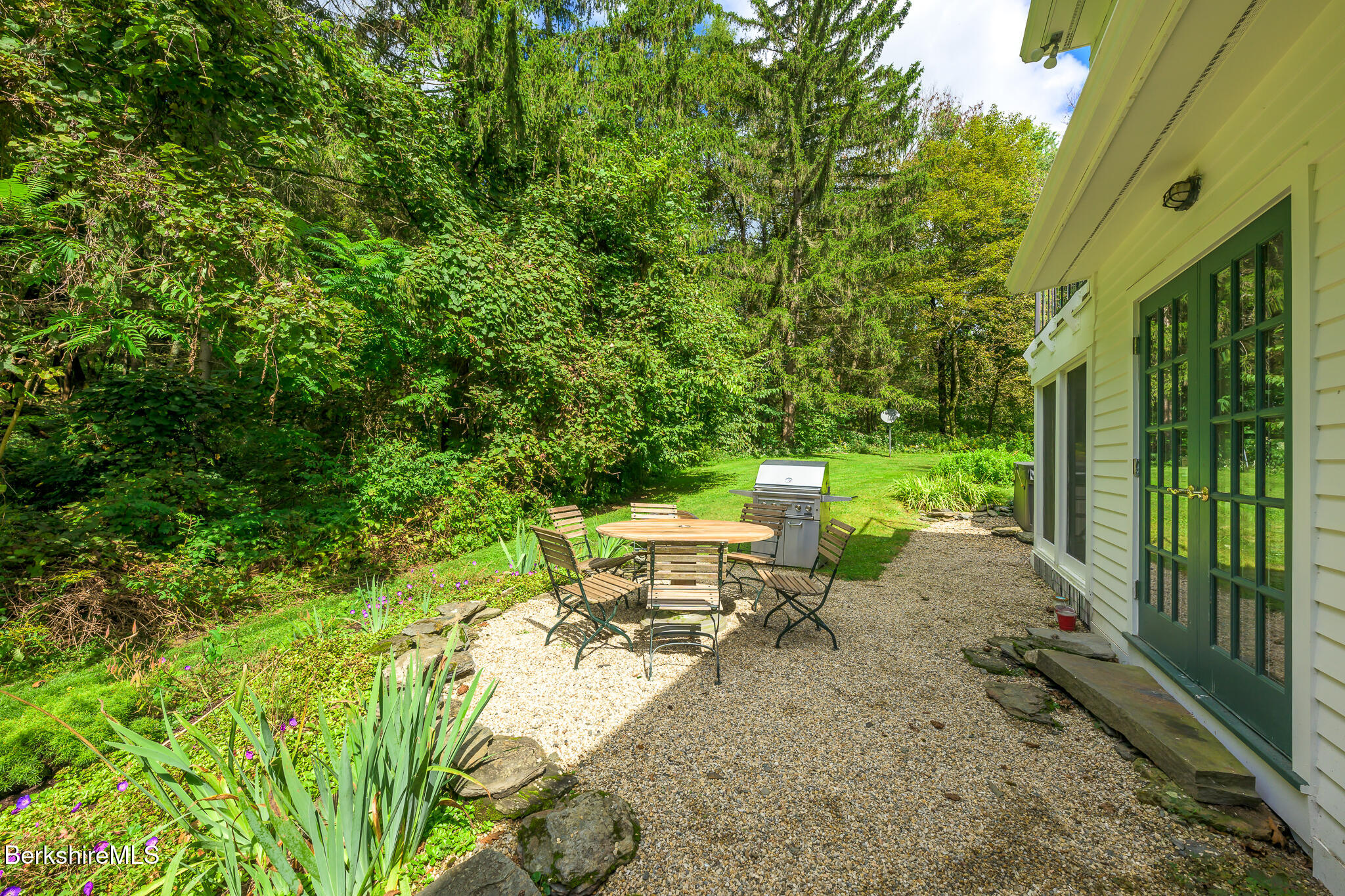 270 Hillsdale Road Egremont, MA 01230 - Photo 32 of 39 a view of a patio with table and chairs and potted plants