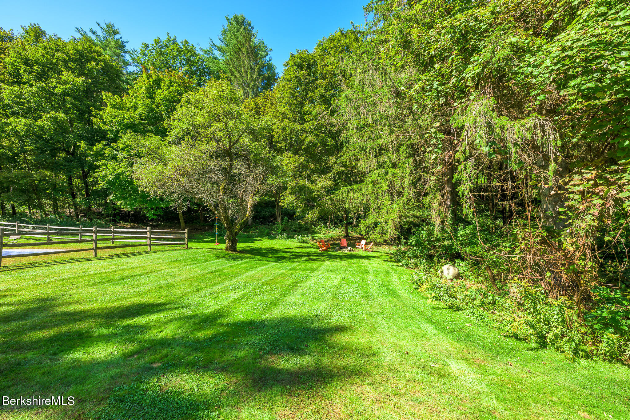 270 Hillsdale Road Egremont, MA 01230 - Photo 34 of 39 a view of a grassy field with trees in the background
