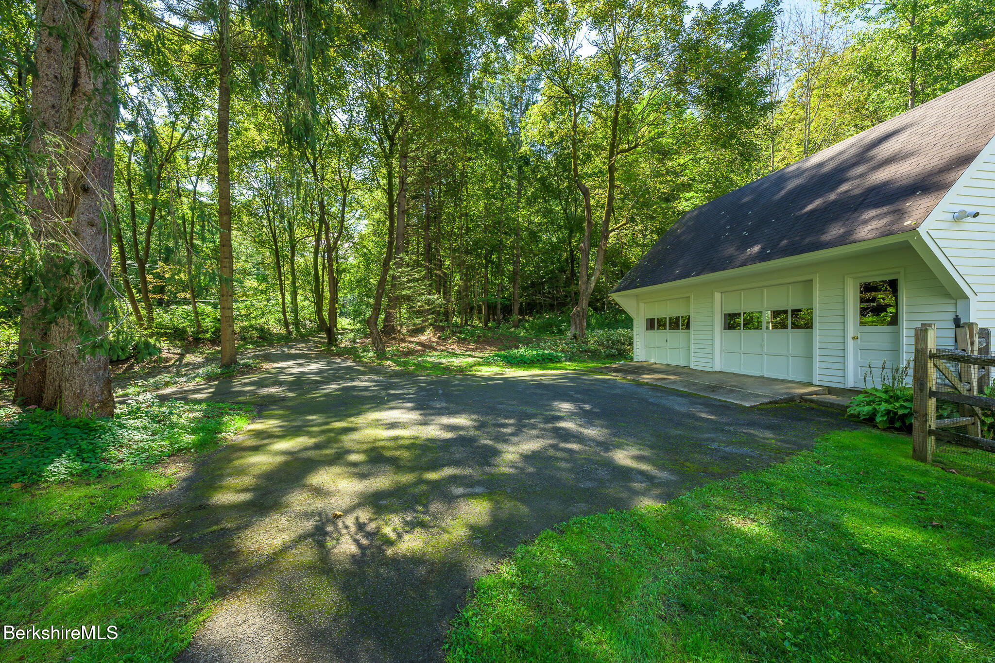 270 Hillsdale Road Egremont, MA 01230 - Photo 38 of 39 a backyard of a house with plants and large trees