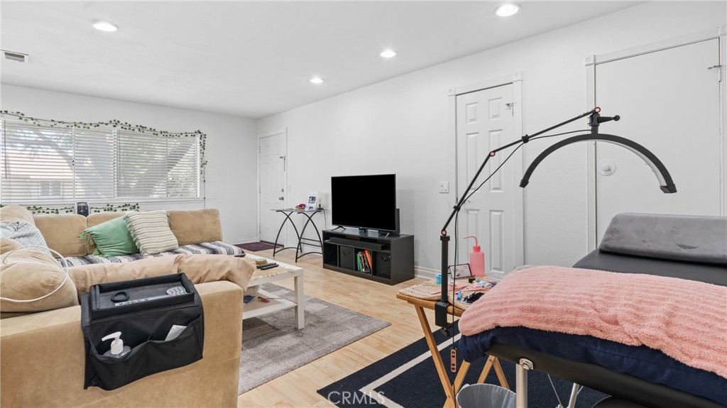 1598 Border Avenue, Unit H Corona, CA 92882 - Photo 11 of 37 a living room with furniture and a flat screen tv