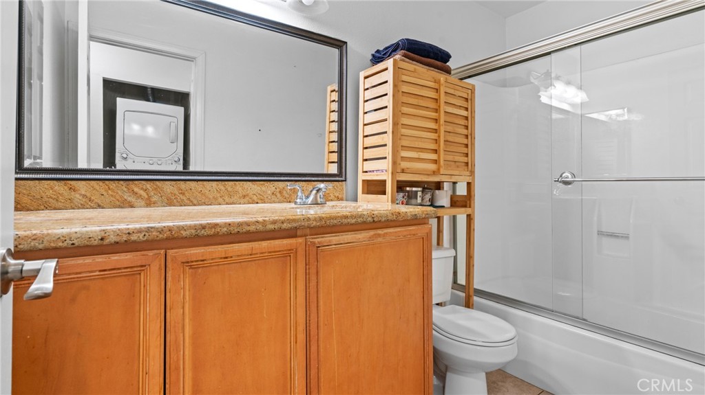 1598 Border Avenue, Unit H Corona, CA 92882 - Photo 12 of 37 a bathroom with a sink and a mirror