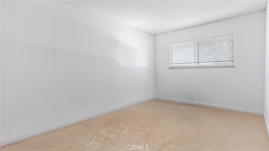1598 Border Avenue, Unit H Corona, CA 92882 - Photo 13 of 37 an empty room with a window