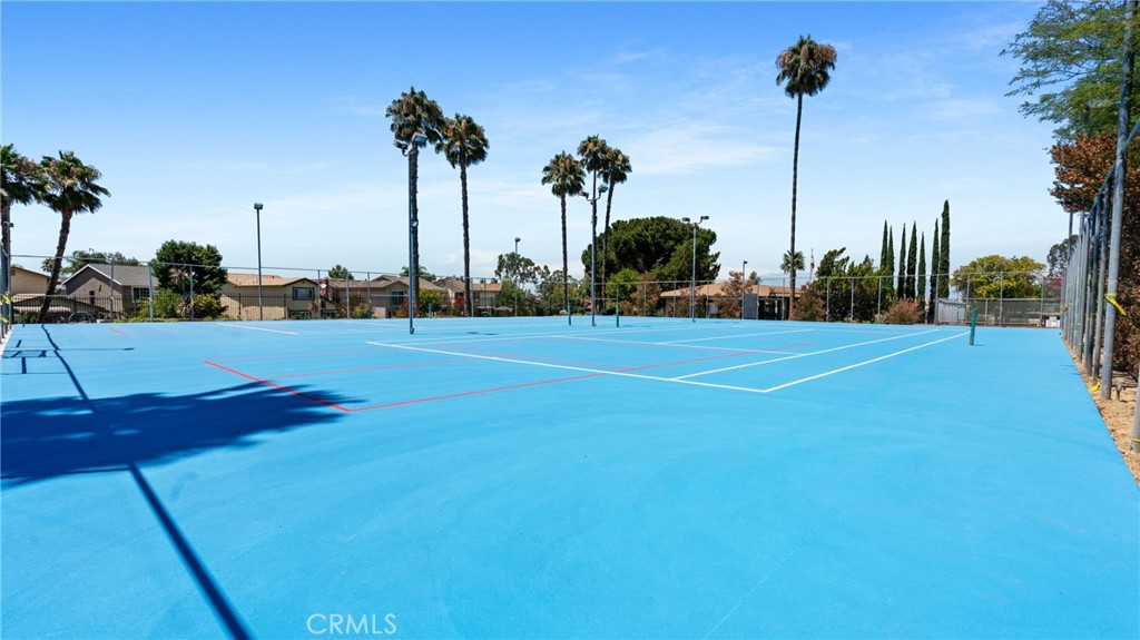 1598 Border Avenue, Unit H Corona, CA 92882 - Photo 21 of 37 a view of a basket ball ground and palm trees