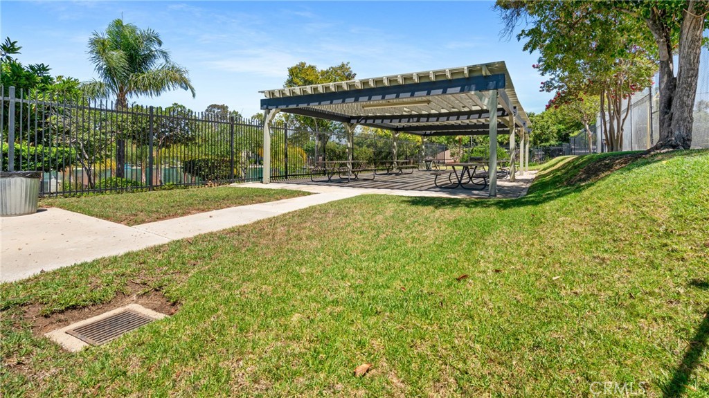 1598 Border Avenue, Unit H Corona, CA 92882 - Photo 22 of 37 a view of a house with swimming pool and porch with furniture
