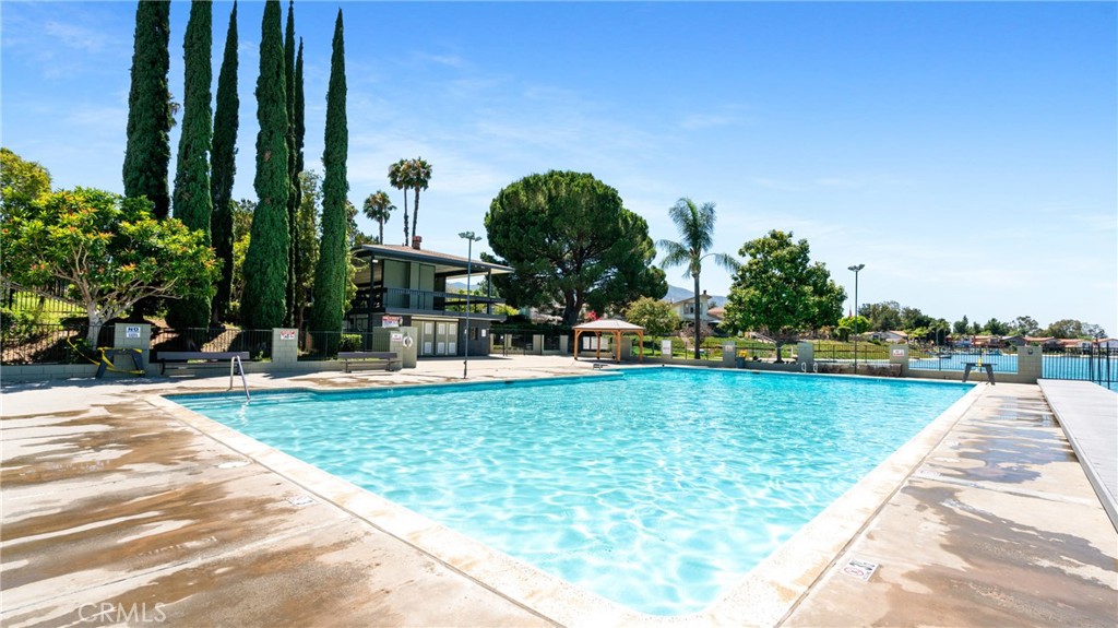 1598 Border Avenue, Unit H Corona, CA 92882 - Photo 28 of 37 a view of a swimming pool with a garden