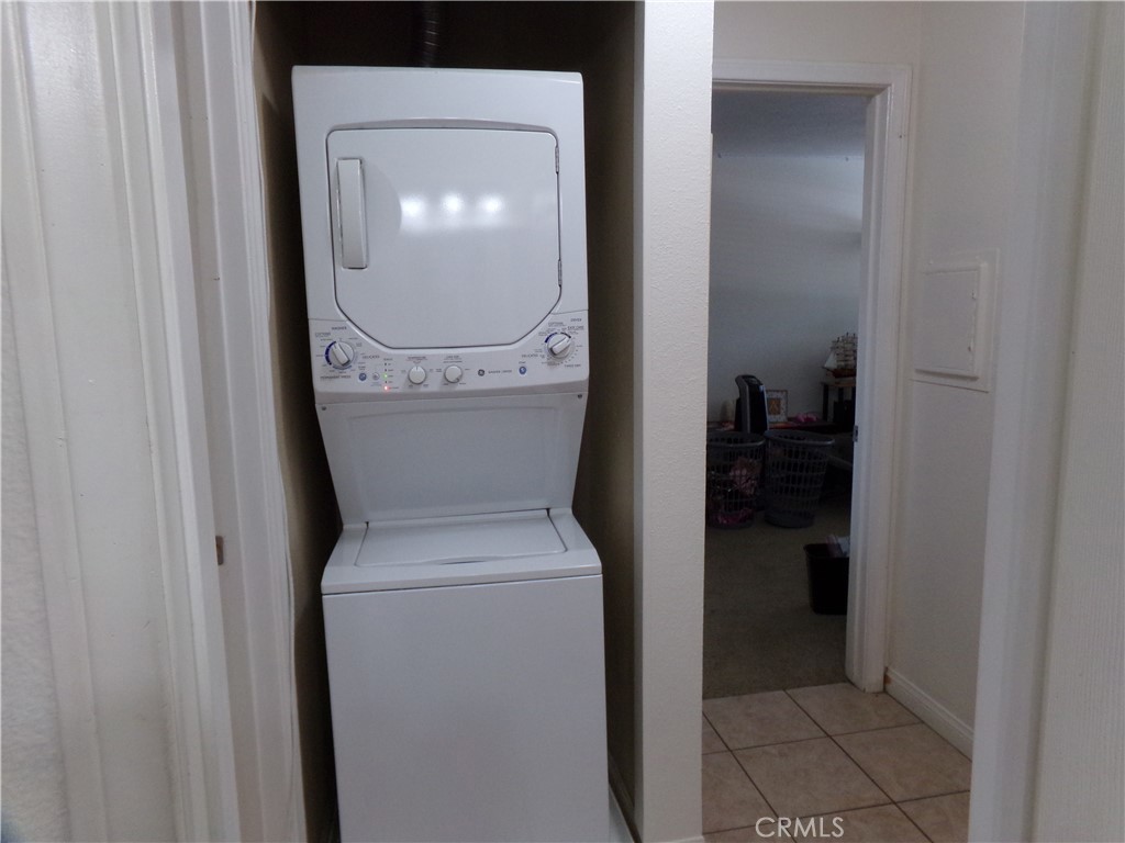 1598 Border Avenue, Unit H Corona, CA 92882 - Photo 34 of 37 a utility room with dryer and washer