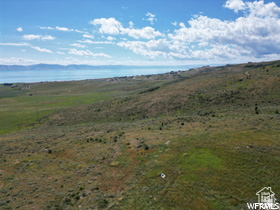 214 Bishop Road, Unit 33 Fish Haven, ID 83287 - Photo 13 of 23 Expansive undeveloped land featuring rolling hills and distant water