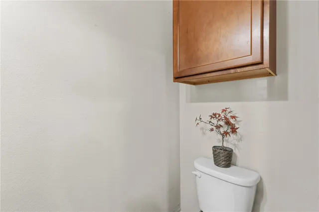 a bathroom with a toilet and a sink