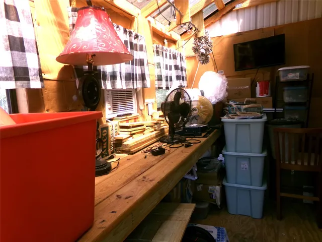 a kitchen with a stove and a wooden floor