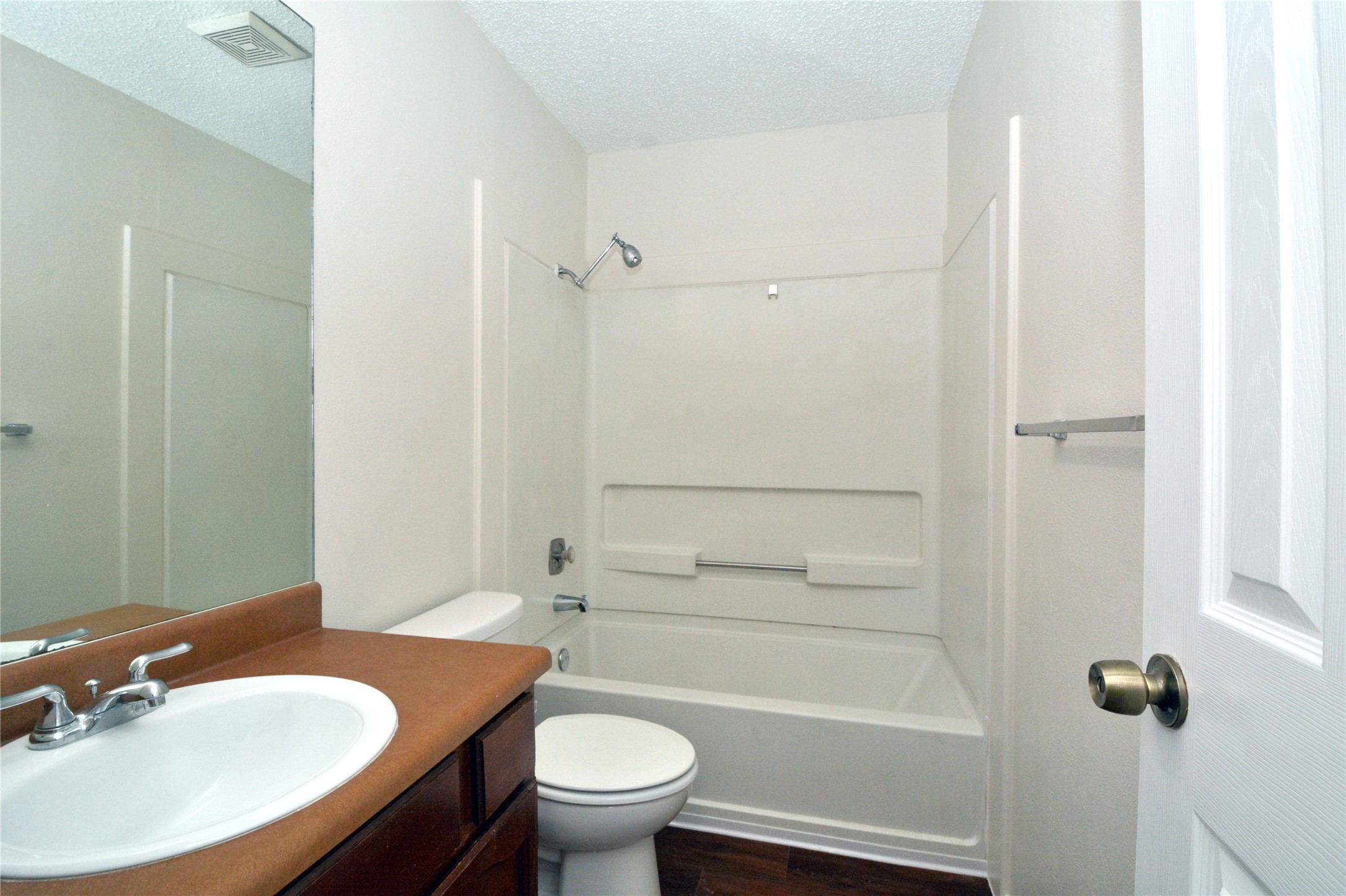 11314 Walnut Ridge Drive, Unit B Austin, TX 78753 - Photo 17 of 19 Functional full bathroom with a bright vanity and convenient tub-shower combination.